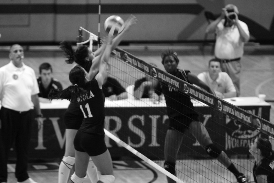 Freshman Rachel Roth and sophomore Gina Gill block an attempted shot during their loss to Millsaps on Sept. 29.