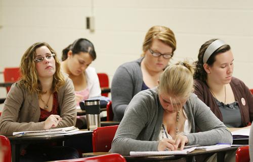 Students in Psychology professor Janet Matthew's " Studies in Psychology of Women"course listen to a lecture Wednesday, Sept 30 in Monroe Hall.