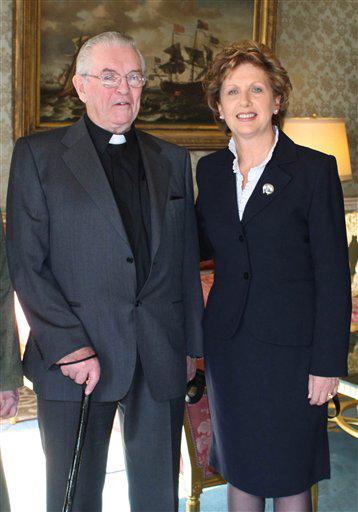 FILE -- This is a Feb. 2008 file photo of the Rev. Aengus Finucane, left, and Ireland's President Mary McAleese. Finucane, a Roman Catholic missionary who braved civil war in Biafra as a pioneer of Irish aid efforts worldwide