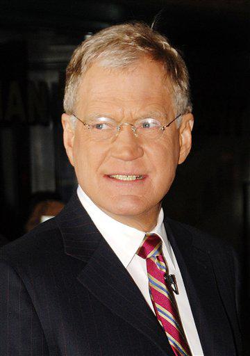 FILE - In this Jan. 17, 2008 file photo, television talk show host David Letterman walks out of The Ed Sullivan Theater during a taping of "The Late Show with David Letterman", in New York.