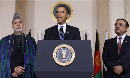 FILE - In this May 6, 2009 file photo President Barack Obama speaks to reporters after his meeting with Afghanistan's President Hamid Karzai, left, and Pakistani President Asif Ali Zardari in the Grand Foyer of the White House in Washington.