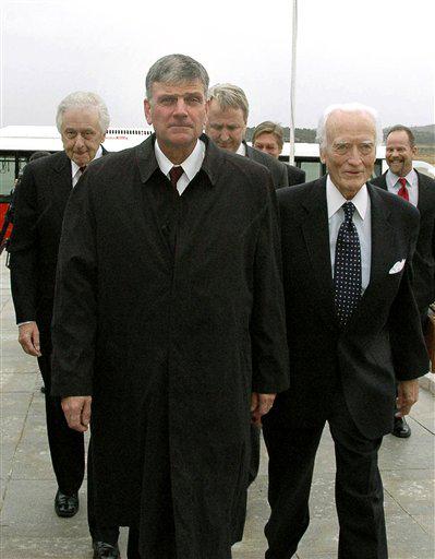Rev. Franklin Graham, front, arrives at Pyongyang airport, North Korea, Tuesday, Oct. 13, 2009. Graham, who leads a Christian relief group, visited North Korea to deliver aid to the impoverished communist nation.