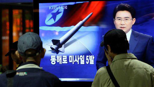 South Koreans watch TV reporting North Korea's missile test at a Seoul Train Station in Seoul, South Korea, Monday, Oct. 12, 2009. North Korea fired five short-range missiles off its east coast on Monday, a news report said, even as South Korea proposed working-level talks with its communist neighbor. The Korean read "North Korea fired five missiles to east coast."