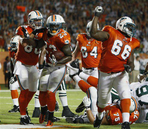 Miami Dolphins runningback Ronnie Brown (23) scores a touchdown