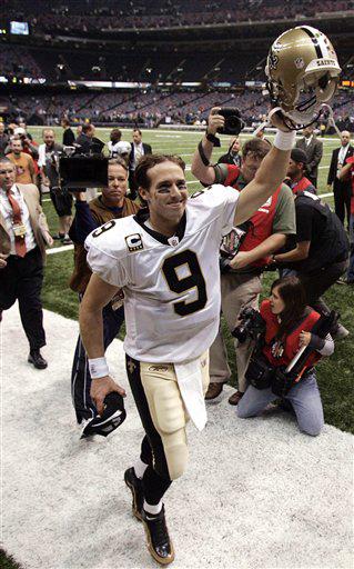 New Orleans Saints quarterback Drew Brees acknowledges fans after an NFL football game against the New York Giants in New Orleans, Sunday, Oct. 18, 2009. Brees insists its time to scrap the finesse label attached to the Saints. The Saints have been consistently outgaining teams on the ground and their defense keeps coming up big.