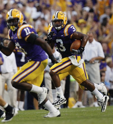 FILE -- This is a Sept. 19, 2009, file photo showing LSU safety Chad Jones (3) getting and escort from LSU linebacker Kelvin Sheppard (11) after intercepting a Louisiana-Lafayette pass in the first half of an NCAA college football game in Baton Rouge, La. Chad Jones had a choice to make. He loves baseball, and the Houston Astros had drafted him out of high school. Yet, he was an excellent football player, and LSU was prepared to let him play both sports. In hindsight, it looks like going to coll