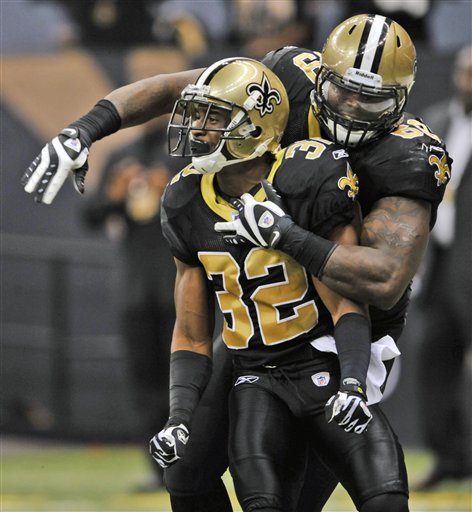 New Orleans Saints cornerback Jabari Greer (32) and defensive end Anthony Hargrove (69) celebrate Greer's touchdown in the first half of an NFL football game against the Atlanta Falcons in New Orleans, Monday, Nov. 2, 2009.