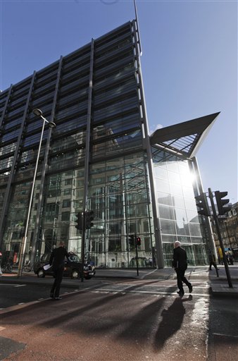 People walk past the headquarters of the Royal Bank of Scotland in London, Monday Nov. 2, 2009, one of the banks which were rescued by government action following the recent worldwide collapse of the financial sector.