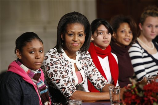 First lady Michelle Obama, second from left, hosts a White House leadership and mentoring initiative event, Monday, Nov. 2, 2009, in the White House State Dinning Room in Washington.