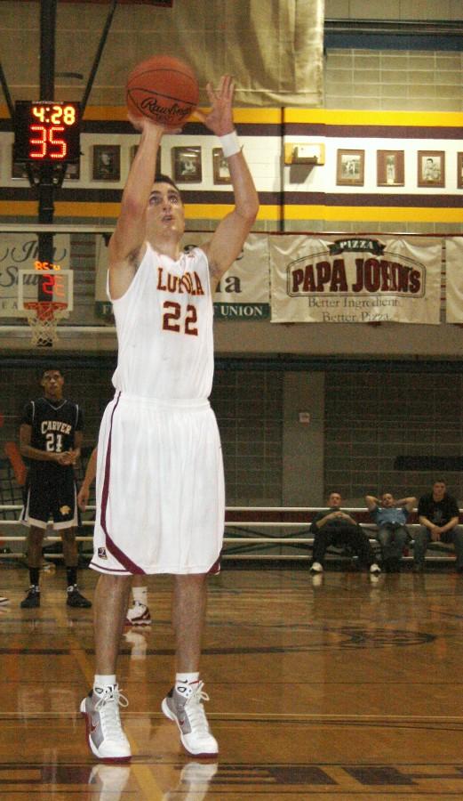 Biology sophomore and basketball guard Sean Apetrei shoots a free-throw at the season opener against Carver Bible College Friday, Oct. 30, 2009. The Wolfpack won 111-54.