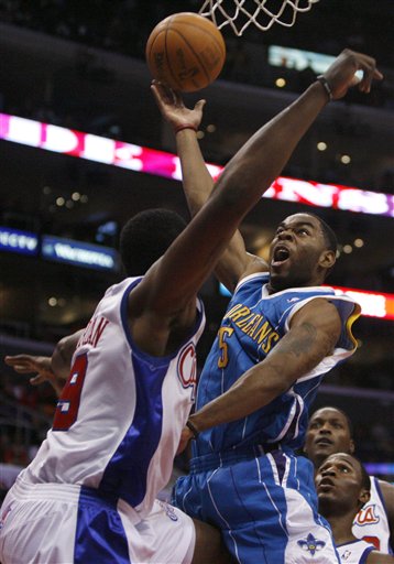 New Orleans Hornets' Marcus Thornton, right, shoots over Los Angeles Clippers' DeAndre Jordan, left, during the first half of their NBA basketball game in Los Angeles on Monday, Nov. 9, 2009.