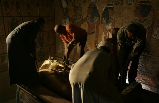 FILE - In this Sunday, Nov. 4, 2007 file photo, the sarcophagus of King Tut is placed back in his underground tomb in the famed Valley of the Kings in Luxor, Egypt. Egypt and the California-based Getty Conservation Institute announced Tuesday, Nov. 10, 2009 a five year project to restore the Tomb of Tutankhamun, the boy king whose golden mask and artifacts have long awed the world.