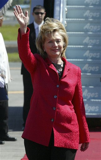 Secretary of State Hillary Rodham Clinton waves upon her arrival at Manila's international airport, Philippines, Thursday, Nov. 12, 2009.