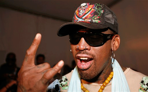 FILE - This July 19, 2008, file photo showing former NBA basketball player Dennis Rodman posing before the Ed Hardy swimwear runway show during the Mercedes-Benz Fashion Week Swim event in Miami Beach, Fla. Rodman was temporarily detained in Germany for allegedly skipping out on a €3,400 ($5,100) hotel bill for a post-game party, a prosecution official said Monday, Nov. 16, 2009.