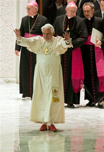 Pope Benedict XVI acknowledges faithful as he arrives for his weekly general audience in the Pope Paul VI hall at the Vatican, Wednesday, Nov. 18, 2009.