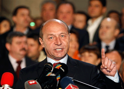 Romania's President in office, Traian Basescu, gestures during a speech after exit polls were released in Bucharest, Romania, Sunday Nov. 22, 2009. Romania held presidential elections, the first since the country joined the European Union in 2007. According to exit polls Basescu leads after the first round followed by the Social Democracy Party candidate Mircea Geoana. An election runoff will be held on Dec. 6.