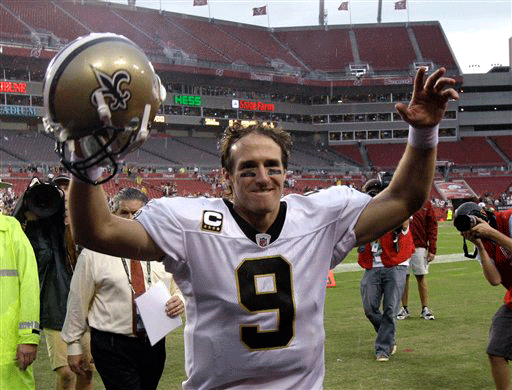New Orleans Saints quarterback Drew Brees waves his arms to fans as he leaves the field after defeating the Tampa Bay Buccaneers 38-7 in an NFL football game in Tampa, Fla., Sunday, Nov. 22, 2009.