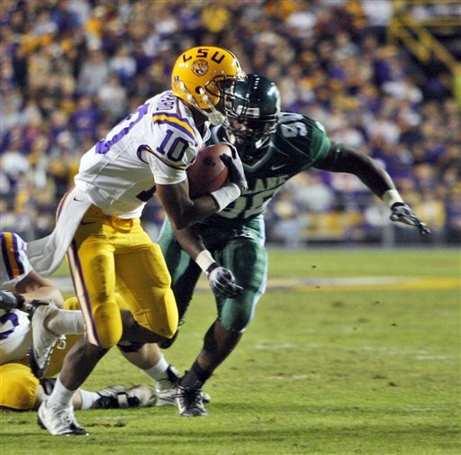 LSU quarterback Russell Shepard (10) runs to the endzone in front of Tulane defensive end Adam Kwentua (90) in the first half of an NCAA college football game in Baton Rouge, La., Saturday, Oct. 31, 2009. Shepard scored on the play.
