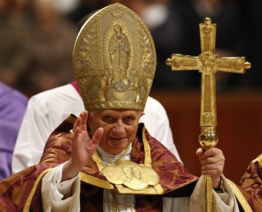 Pope Benedict XVI delivers his blessing during a Vespers Mass in St. Peter's Basilica at the Vatican, Saturday, Nov. 28, 2009. 