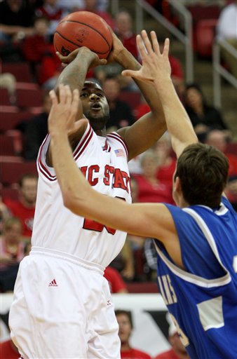 North Carolina State's Tracy Smith, left, shoots over the defense of New Orleans Jaroslav Tyrna (13) during the first half of an NCAA college basketball game on Sunday, Nov. 29, 2009, at the RBC Center in Raleigh, N.C.