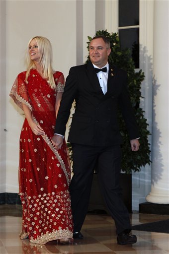 FILE - In this Tuesday, Nov. 24, 2009 file photo, Michaele and Tareq Salahi, right, arrive at a State Dinner hosted by President Barack Obama for Indian Prime Minister Manmohan Singh at the White House in Washington. This time, the picture is the story. After the Secret Service insisted that President Barack Obama was never endangered by a security breach that allowed a couple to crash his first state dinner, the White House has released a photo showing that not only did the pair get close to Ob