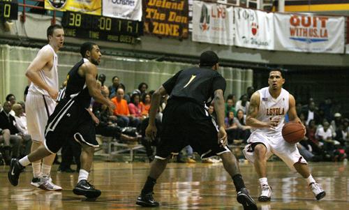 Corey Gray, biology sophomore, rushes past a Belhaven University player Feb. 20 during the Hall of Fame Game.