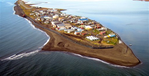 FILE - In this file photo taken Sept. 11, 2006 and released by the Northwest Arctic Borough, a new sea wall that runs along the seaward side of the village of Kivalina, Alaska is shown. One of Alaska's most eroded villages wants to revive a lawsuit that claims greenhouse gasses from oil, power and coal companies are to blame for the climate change endangering the tiny community. The city of Kivalina and a federally recognized tribe, the Alaska Native village of Kivalina, filed the case in federa