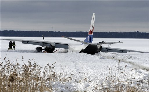 A Polish cargo plane, which has made an emergency landing on a frozen lake near the capital due to landing gear and engine problems, is seen on Thursday, March 18, 2010. One of the six crew members suffered minor injuries as the Antonov AN26 turboprop aircraft en route from Finland to Estonia landed on the ice of Lake Ulemiste.