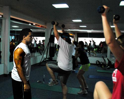 In his weekly Bootcamp class in the Recreational Sports Complex, Lewins Walter instructs a group on weight training.