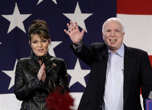 Sen. John McCain, R-Ariz., right, is joined on stage by Sarah Palin as she makes an appearance with him at a rally at the Pima County Fairgrounds in Tucson, Ariz. on Friday, March 26, 2010. McCain, who is running for another term in the U.S. Senate, was joined by Palin for their first campaign rally together since losing the presidential election in 2008. 