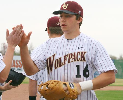 Management freshman, Tyler Duplantis, 16, receives high fives from his teammates as he runs to the dug out during a game against Faulkner University Tuesday, March 16.