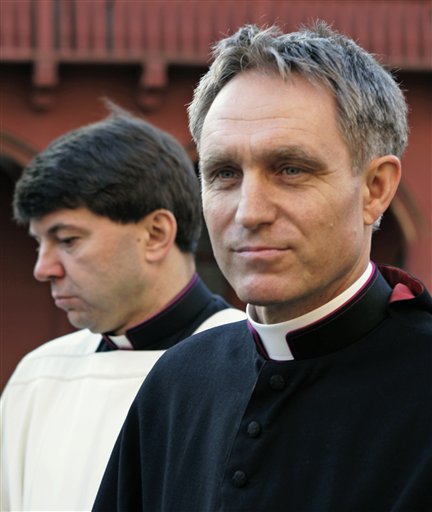 FILE - In this Jan. 10, 2008 file picture German priest Georg Gaenswein, personal secretary of Pope Benedict XVI, follows the coffin of late German archbishop Oskar Saier towards the cathedral in Freiburg, southern Germany. Pope Benedict XVI's private secretary on Tuesday April 13, 2010 defended the Holy Father's prolonged silence on the flood of sexual abuse cases in Germany's Roman Catholic church - some of them in Benedict's own former diocese - saying it is the bishops' responsibility to dea