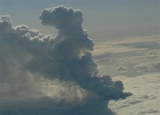 In this image taken from TV Wednesday April 14, 2010, shows smoke rising from the crater of the volcano under the Eyjafjallajokull glacier in Iceland, which erupted for the second time in less than a month, melting ice, shooting smoke and steam into the air and forcing hundreds of people to flee rising floodwaters. Authorities evacuated 800 residents from around the glacier as rivers rose by up to 10 feet (3 meters). Emergency officials and scientists said the eruption under the ice cap was 10 t