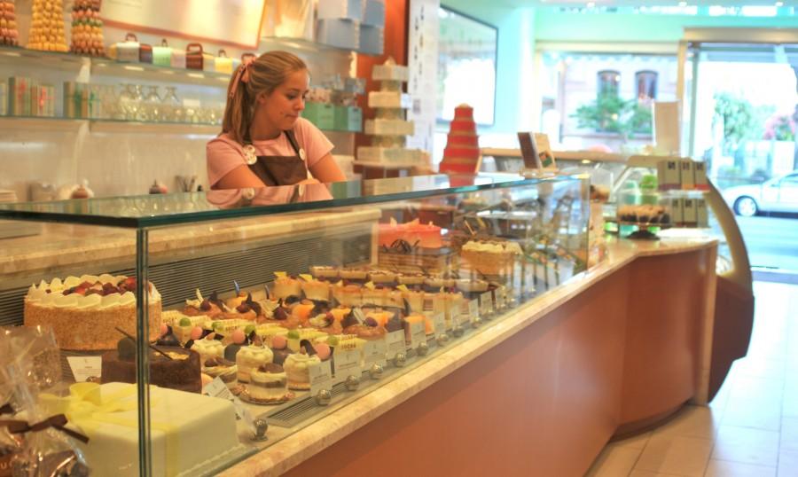 A Sucre server stands by the pastry selection during down time.