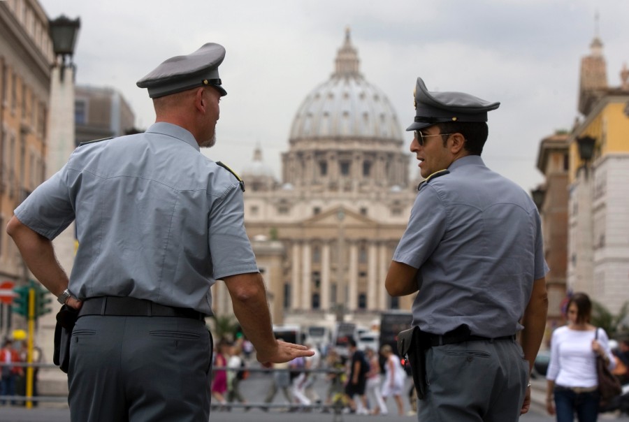 Italian+financial+Police+officers+talk+to+each+other+in+front+of+St.+Peters+square+at+the+Vatican%2C+Tuesday%2C+Sept.+21%2C+2010.+Just+when+the+Catholic+Church+didnt+need+another+scandal%2C+Italian+authorities+have+seized+euro23+million+%28%2430.18+million%29+from+a+Vatican+bank+account+and+begun+investigating+top+officials+of+the+Vatican+bank+in+connection+with+a+money+laundering+probe.