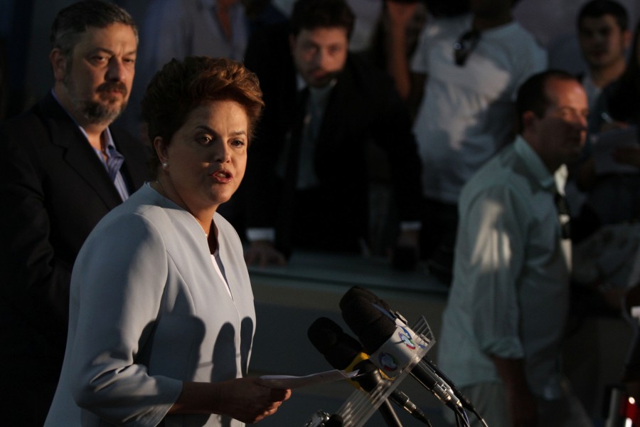 Accompanied by her campaign coordinator Antonio Palocci, left, Workers Party presidential candidate Dilma Roussef, second from left, speaks during a press conference in Brasilia, Brazil, Thursday, Sept. 23, 2010. Brazil will hold general elections on Oct. 3.