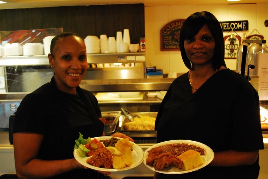 Workers display some of Dunbars delicious Louisiana fare.