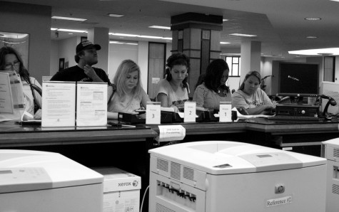 In an effort to conserve paper and ink, a new policy now forces students to have to wait for library attendants to sort through print-outs before retreiving their work.