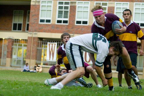 General studies and business freshman, Daniel Williams, hits political science junior Warren Oliver, at a recent rugby practice. The rugby team practices three times a week in the Residential Quad at Loyola.