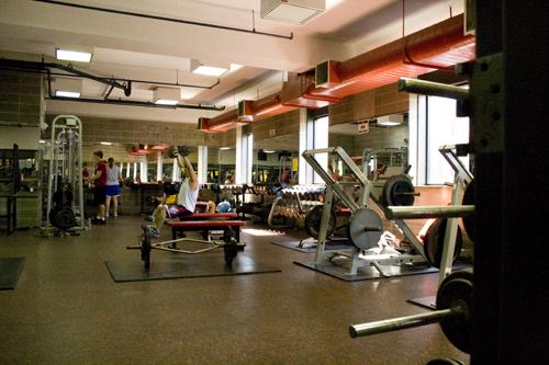 Students exercise in the weight room of the Rec Plex.