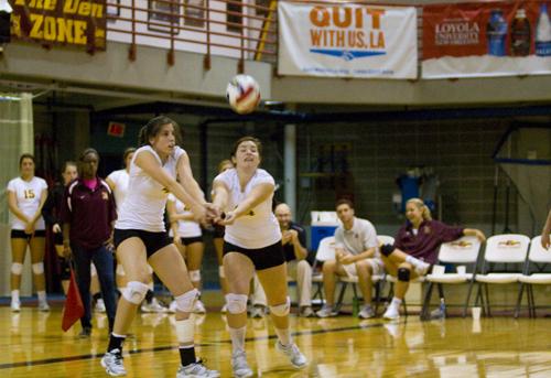 Loyola goes for a dig at a family weekend game on Saturday, Oct. 2. The Wolfpack defeated Xavier in three games.