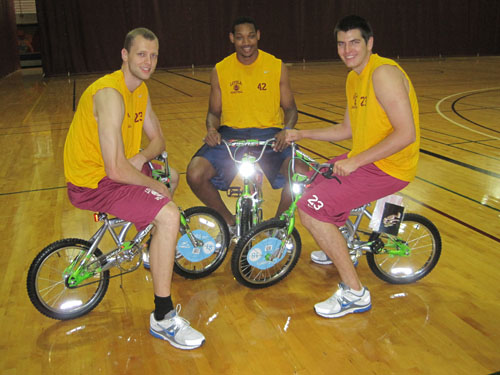 Men’s basketball players management junior Marc Luttecke, marketing senior Darrington MonCrieffe and management junior Cameron Cates get ready for Friday’s festivities.