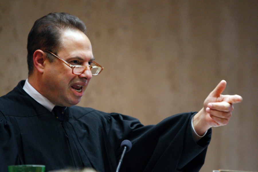 Superior Court Judge Michael Ravin gestures while sentencing Melvin Jovel, 21, Thursday, Nov. 4, 2010, in Newark, N.J., to three consecutive life terms in prison plus 20 years, for pulling the trigger in the execution-style killings of three college students in a New Jersey schoolyard in 2007. Jovel pleaded guilty to murder, attempted murder and weapons charges days before his trial was to begin in September.