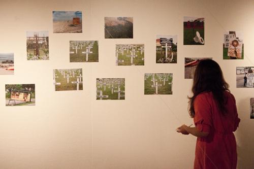 A students examines one of the works of art displayed in the Danna Center. 