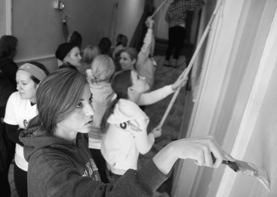 Students volunteers paint the interior of Odyssey house in Midcity on Saturday Nov. 6 during Wolves on the Prowl. Wolves on the Prowl is a Loyola mission to get out and give back to the New Orleans community through community service.