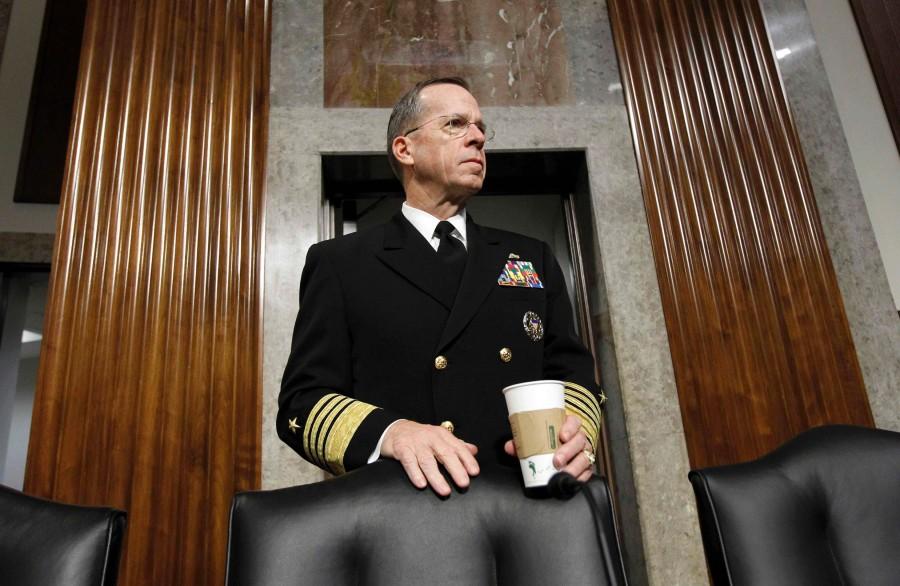 Joint Chiefs Chairman Adm. Michael Mullen pauses on Capitol Hill in Washington Thursday, Dec. 2, 2010, Prior to testifying before the Senate Armed Services Committee's Don't Ask Don't Tell policy hearing. 
