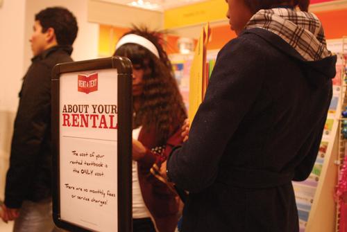 Students line up at the university book store to buy or rent textbooks for the spring semester. Rental textbooks are offered to Loyola University students.