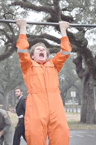 Calvin Monley, English senior, does pullups during the Man-a-thon. Competitors in the Man-a-thon performed feats of strength around Audubon Park.