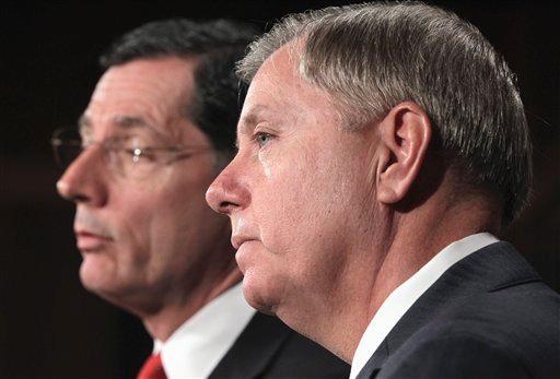 Sen. Lindsey Graham, R-S.C., right, and Sen. John Barrasso, R-Wyo. take part in a news conference, on Capitol Hill in Washington, Tuesday, Feb. 2, 2011, to repeat their opposition to the national health care law and to call for legislation to allow individual states to opt out of his major provisions - the individual mandate, employer mandate, and expansion of Medicaid.