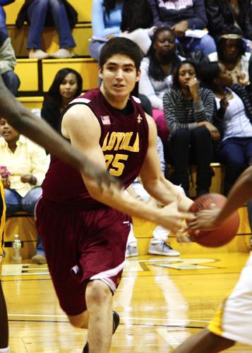 No. 35 Robert Lovaglio drives through the lane against Xavier University’s men’s basketball team. Lovaglio scored a career high 29 points during the game.